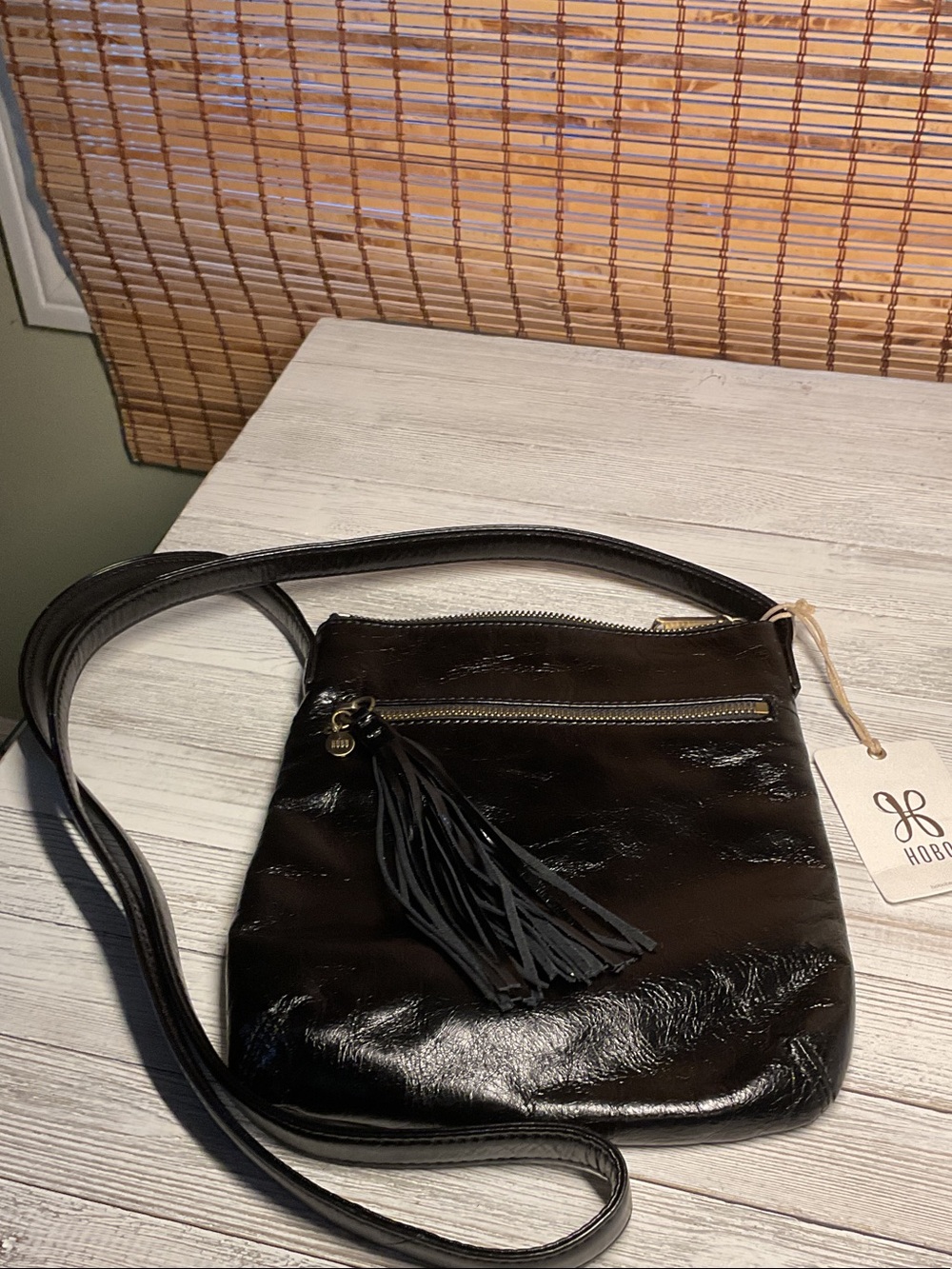 Hobo black leather crossbody bag with tassel zipper pull NWT vintage finish
